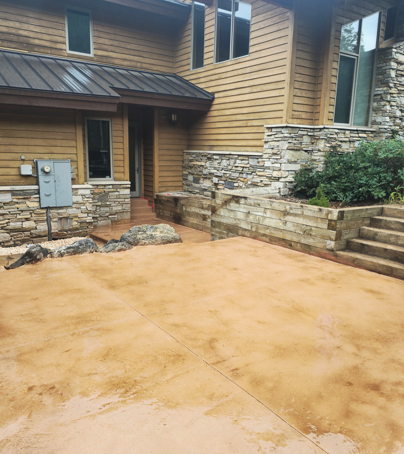 house and stained concrete pad